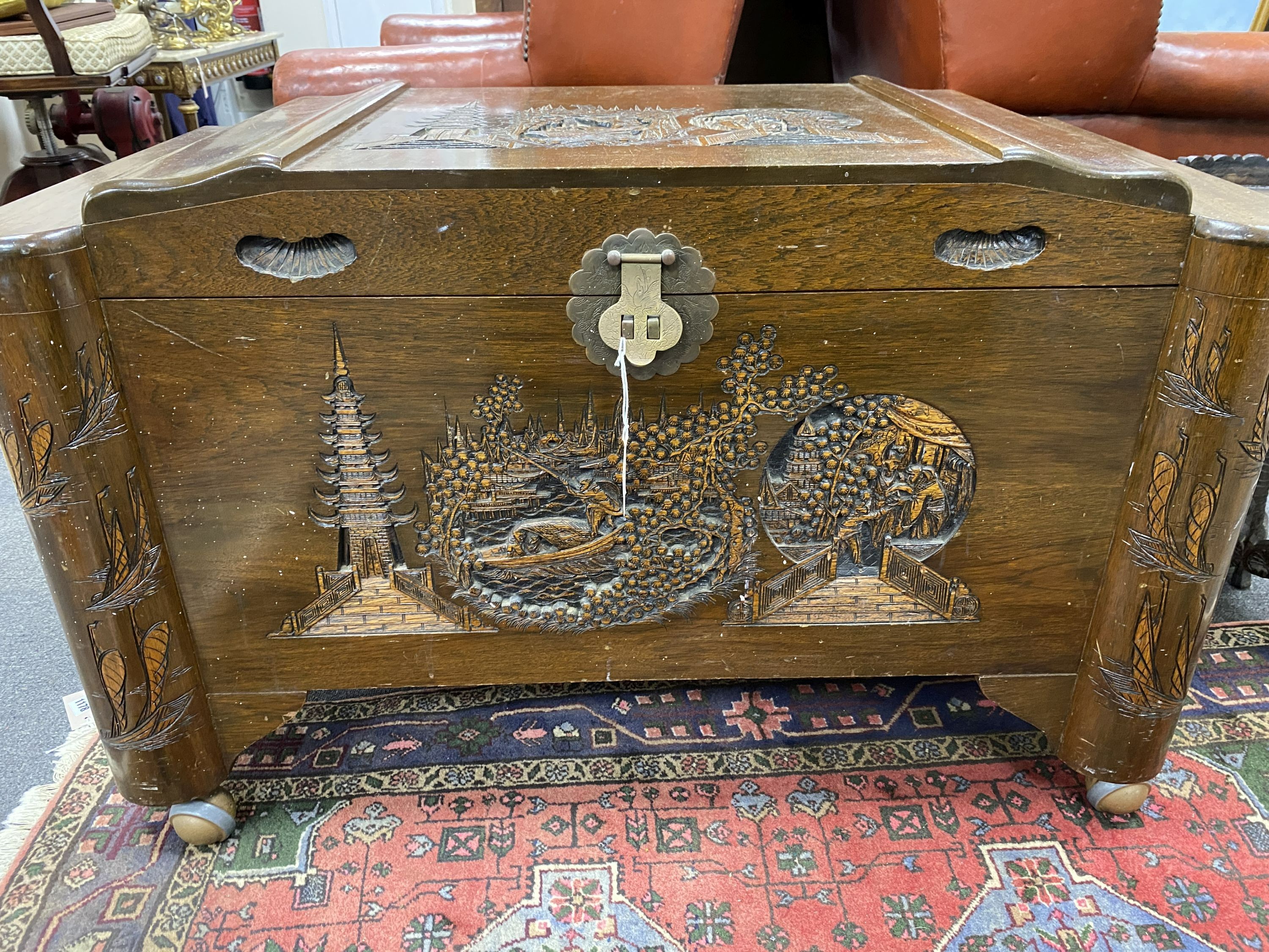 A Chinese carved teak and camphorwood lined chest, length 100cm, depth 54cm, height 64cm